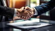 © Kwangvann Ztudio - A close-up of a handshake over a signed contract, symbolizing the completion of a consulting deal, signed contract, consulting agreement