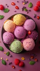 Poster - A bowl of colorful ice cream scoops with berries and mint on a pink background.