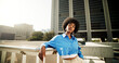© Flashizzle/peopleimages.com - Portrait, fashion and black woman in city, attitude and travel with buildings, urban town or edgy. African person, gen z or girl in street, pride or commute with stunning outfit or stylish clothes