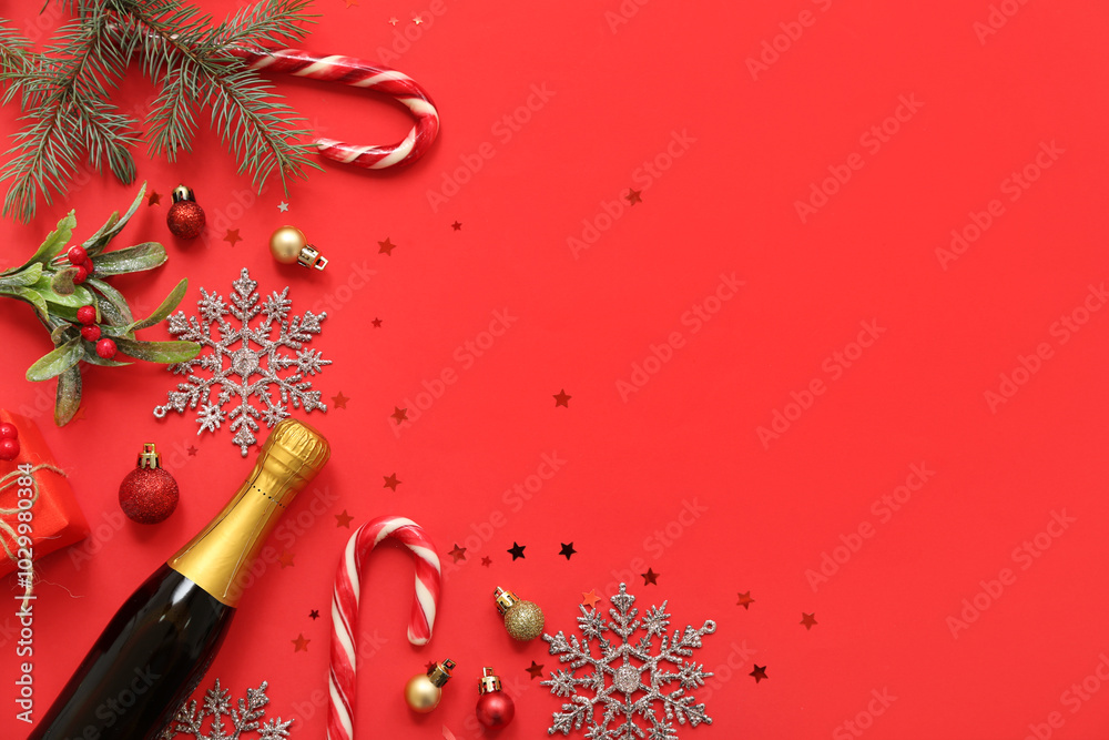 Champagne bottle with Christmas decor on red background