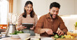© WesLens/peopleimages.com - House, cooking and couple with tablet, funny and bonding together with online recipe. Apartment, man or woman in kitchen, vegetables or tech with organic food, ingredients or website for nutrition