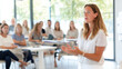 © Robert Kneschke - Confident woman delivers presentation during corporate meeting