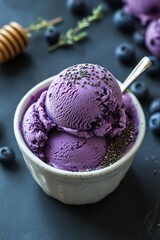 Poster - Two scoops of homemade blueberry ice cream with chia seeds and honey in a bowl.