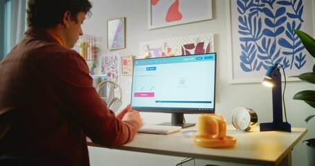 Fototapete - young man types text prompt in ai video generator on computer. pc screen shows artificial intelligen