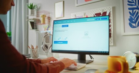 Fototapete - Young man enters prompt in artificial intelligence chatbot app on PC. Advanced AI video generator generates detailed high-quality video of modern house. From text prompt to realistic generated video.