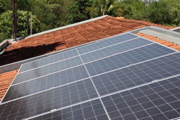 Alternative and sustainable energy. Clean energy. Solar energy, Photovoltaic panels installed on a roof.