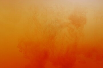 Wall Mural - Orange color dye melt on white background,Abstract smoke pattern,Colored liquid dye,Splash paint	