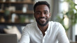 © ifoto - Portrait of smiling man sitting at desk with laptop looking in camera