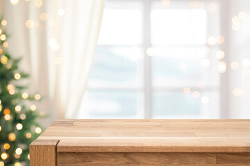 Wall Mural - blur christmas tree and window interior background with empty wooden table in front for display prod