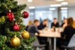 © Marina Demidiuk - Christmas tree on a foreground, blurred Festive Office Meeting on a background. Business people. Coworking, decorated Xmas tree. Copy space, holiday spirit. Selective focus. Seasonal winter festivity