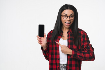 Extremely happy woman girl female student holding using smart cell mobile phone showing demonstrate mock up blank screen pointing finger isolated on white background copy space. Technology concept