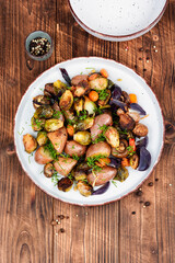 Wall Mural - Roasted vegetable medley including potatoes brussels sprout.