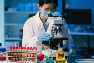 Wall Mural - scientist mixing chemical liquids in the chemistry lab. researcher working in the chemical laborator