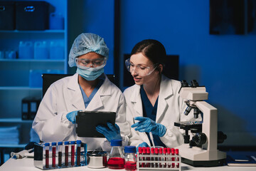 Wall Mural - team scientist mixing chemical liquids in the chemistry lab. researcher working in the chemical labo