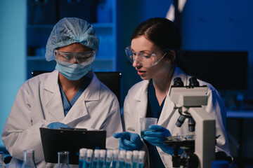 Wall Mural - team scientist mixing chemical liquids in the chemistry lab. researcher working in the chemical labo