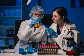 Wall Mural - team scientist mixing chemical liquids in the chemistry lab. researcher working in the chemical labo
