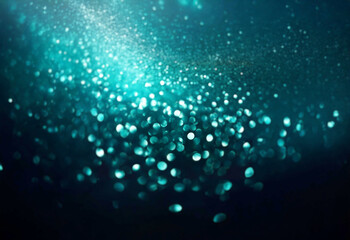Poster - Abstract teal and white bokeh on a dark background.