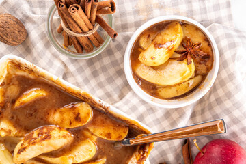 Caramel and cinnamon baked apples, paleo, vegan low-carb diet autumn dessert, apple pie trendy viral alternative, in baking pan and portioned