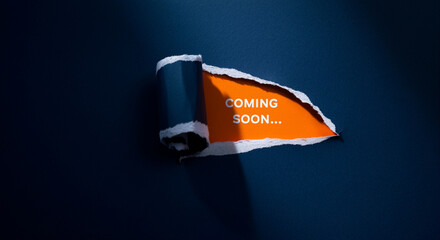 Leinwandbilder - Torn paper with coming soon message on dark background for mockup design