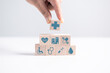 © doidam10 - Concept of health insurance is represented by wooden cube, symbolizing comprehensive plan includes hospital care, medicine, and business services to manage disease effectively. insurance, health.