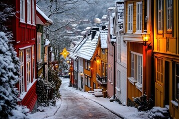 Poster - A picturesque snow-covered street with colorful houses and warm lights in winter.