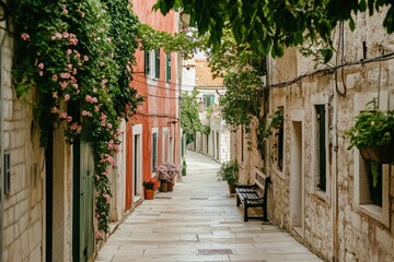 Poster - A picturesque alleyway adorned with flowers and charming buildings.