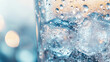 © ABX - Glass of soda with bubbles and refreshing ice close-up