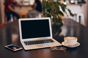 Aufkleber - Laptop, coffee and cafe with phone on table for online research, networking and morning caffeine. Technology, beverage and mug with warm drink in restaurant for business, internet or freelance career