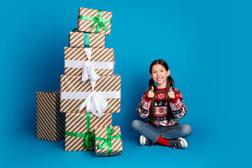 Canvas Print - Photo of lovely pretty cute girl wear ugly ornament sweater indicating you pile stack gifts isolated on blue color background