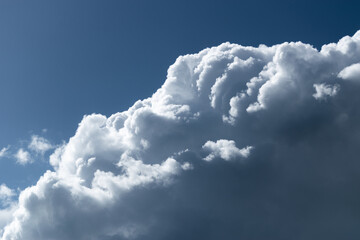 Sunlit cloud in sky, layers of rim light