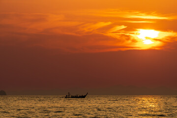 Wall Mural - Longtail boat at sunset at Ao Nang Beach, Thailand