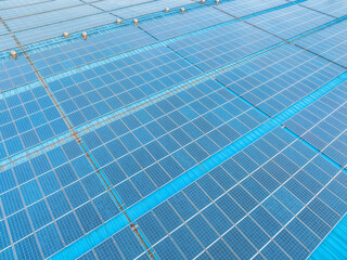 Wall Mural - Aerial view of solar panels on factory roof