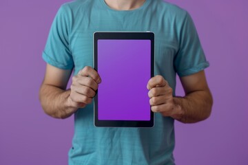 App mockup caucasian man in his 40s holding a tablet with an entirely purple screen