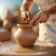 © Niks Ads - pottery wheel and making clay pot