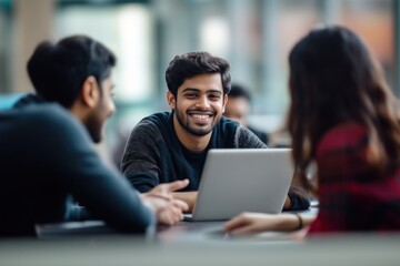 Sticker - A group of international Indian students working laptop conversation college.