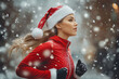 © Татьяна Евдокимова - Young woman wearing a santa hat and red athletic wear is running outside on a snowy winter day