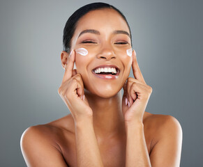 Poster - Woman, portrait and smile with creme in studio for collagen treatment, skin hydration and beauty. Mockup, skincare and cosmetics product with hyaluronic acid, retinol and wellness on gray background