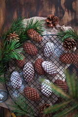 Christmas homemade chocolate pine cone shortbread cookies, powdered sugar dressing, Holiday or New Year decoration