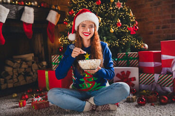 Sticker - Photo of charming adorable lovely girl eating popcorn watching film movie new year weekend indoors