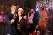 © Pixel-Shot - Couple of friends with champagne at New Year party
