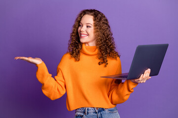 Canvas Print - Portrait of lovely young girl arm hold laptop empty space wear sweater isolated on purple color background