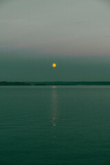 Wall Mural - The moon above Lake Mjøsa in October.