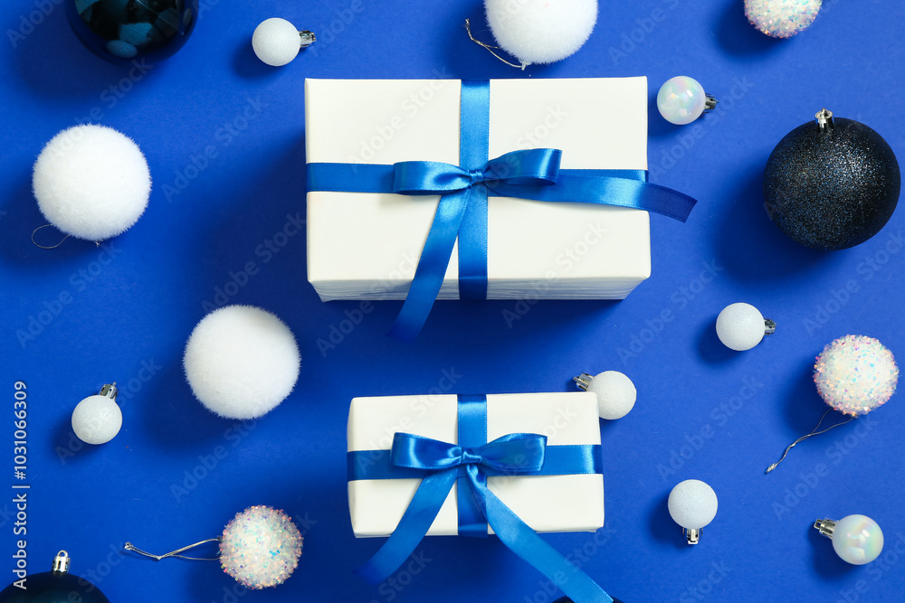 Gift boxes with Christmas balls on blue background
