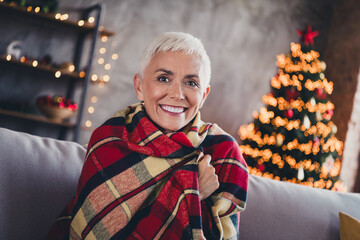 Poster - Photo of nice aged woman sit couch covered blanket wear sweater christmas festive holiday apartment indoors