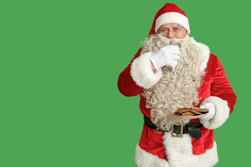 Sticker - Santa Claus drinking milk with tasty cookies on green background