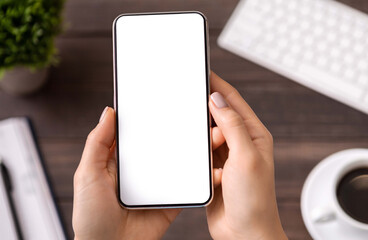Poster - Woman demonstrating new modern smartphone with blank white screen for advertisement or application mockup