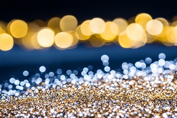 Wall Mural - abstract glitter lights in gold, blue, and black on a defocused background