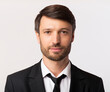 © Prostock-studio - ID Photo. Portrait Of Businessman In Suit Looking Friendly At Camera Over White Background. Studio Shot, Isolated