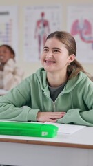 Aufkleber - Education, funny and student girl at desk in classroom for lecture, lesson or study. Happy, laughing and smile of learner with braces at college, school or university for learning and development