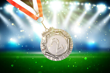 Wall Mural - second place silver medal at sports field, closeup